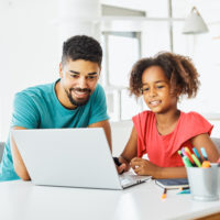 Huntington Learning Center Franchise student working from home with her father